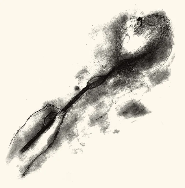 A hand holding a long spoon, dark with shadow.