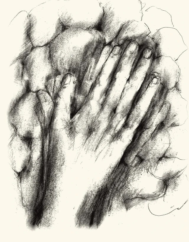 Two hands pressed flat against a wall of fieldstone.