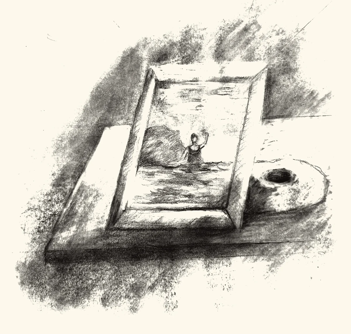 A framed photograph of a swimmer waving, set on a table beside a donut.